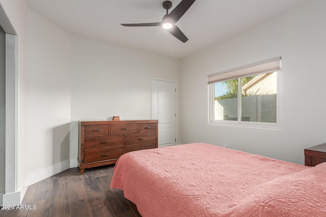 bedroom featuring ceiling fan and dark wood-type flooring