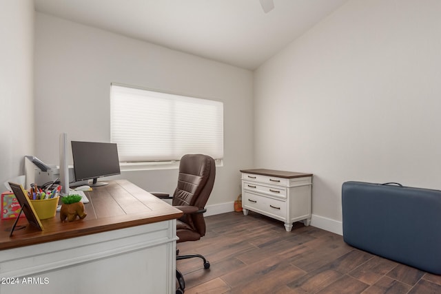 home office with vaulted ceiling and dark wood-type flooring