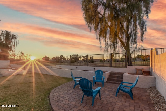 view of patio terrace at dusk