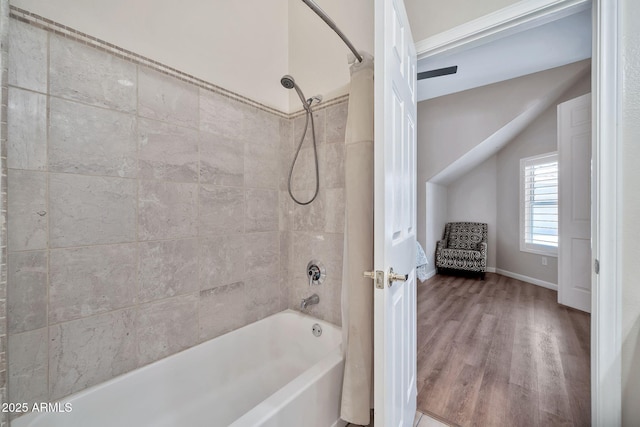 8245 E Bell Rd Unit 133, Scottsdale, AZ 85260 - full bathroom with shower / bath combination, wood finished floors, and baseboards