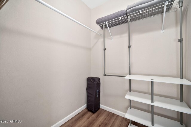 8245 E Bell Rd Unit 133, Scottsdale, AZ 85260 - walk in closet with wood finished floors