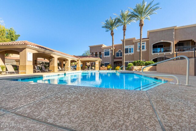 8245 E Bell Rd Unit 133, Scottsdale, AZ 85260 - community pool featuring a patio area and fence