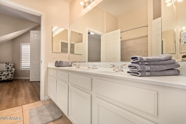 8245 E Bell Rd Unit 133, Scottsdale, AZ 85260 - full bath featuring tile patterned floors, double vanity, and a sink
