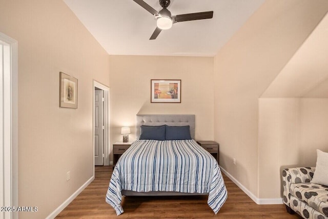 8245 E Bell Rd Unit 133, Scottsdale, AZ 85260 - bedroom with wood finished floors, ceiling fan, and baseboards