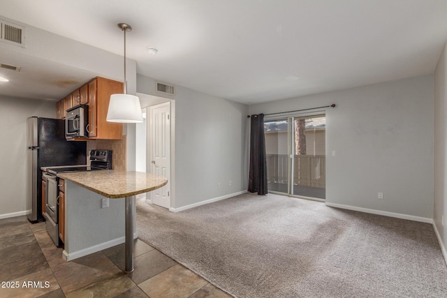 200 E Southern Ave Unit 226, Tempe, AZ 85282 - kitchen with stainless steel appliances, brown cabinets, baseboards, and light countertops