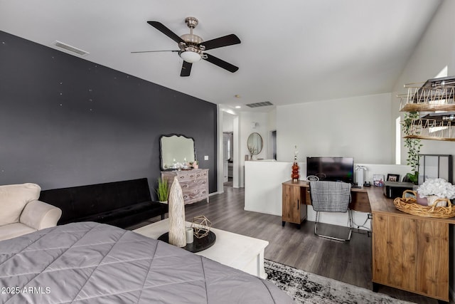 bedroom featuring ceiling fan, visible vents, and wood finished floors