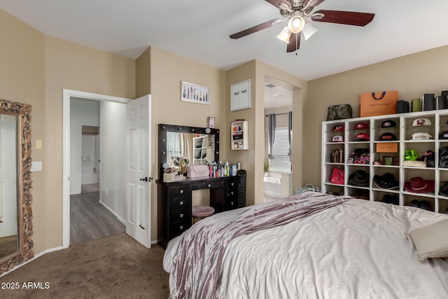 carpeted bedroom featuring baseboards and ceiling fan