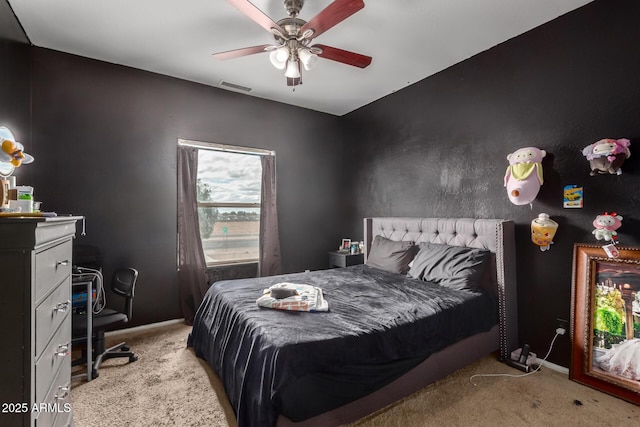 bedroom featuring carpet flooring, baseboards, visible vents, and a ceiling fan