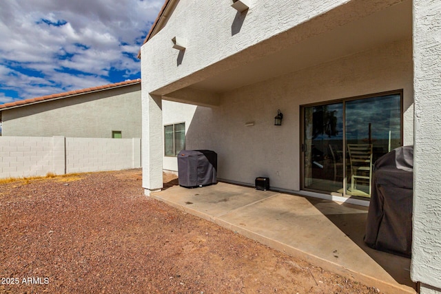 view of patio / terrace featuring fence