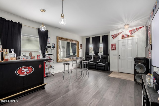 foyer with wood finished floors and baseboards