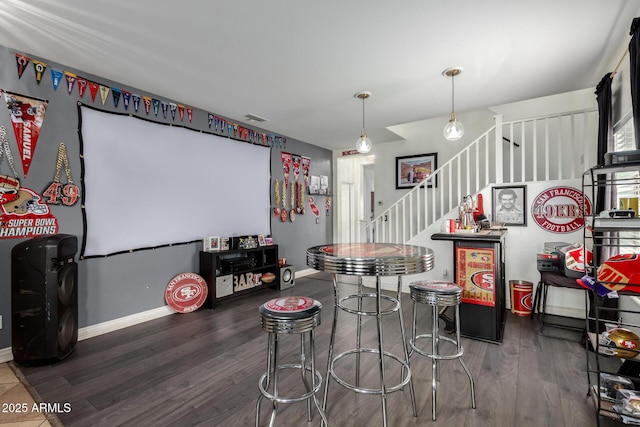 playroom with visible vents, baseboards, and wood finished floors