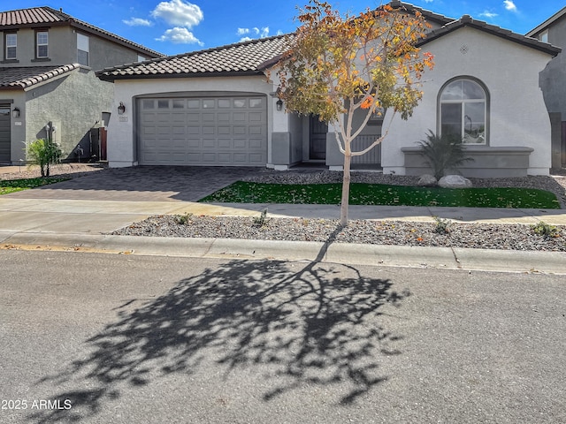 15787 W Mariposa Grande St, Surprise, AZ 85387 - mediterranean / spanish home with a garage, stucco siding, decorative driveway, and a tile roof