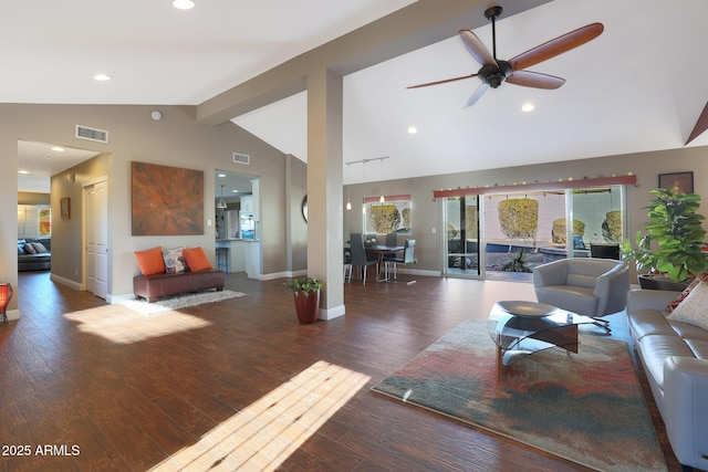 living room with ceiling fan, lofted ceiling with beams, and dark hardwood / wood-style floors