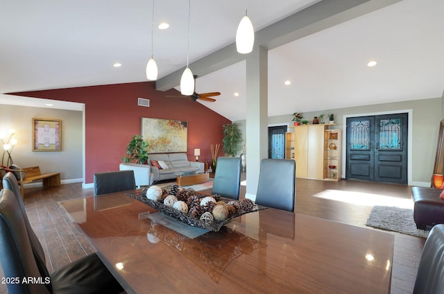 dining area with hardwood / wood-style floors, ceiling fan, and lofted ceiling