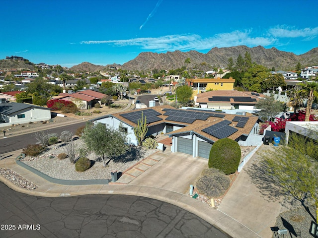 birds eye view of property featuring a mountain view