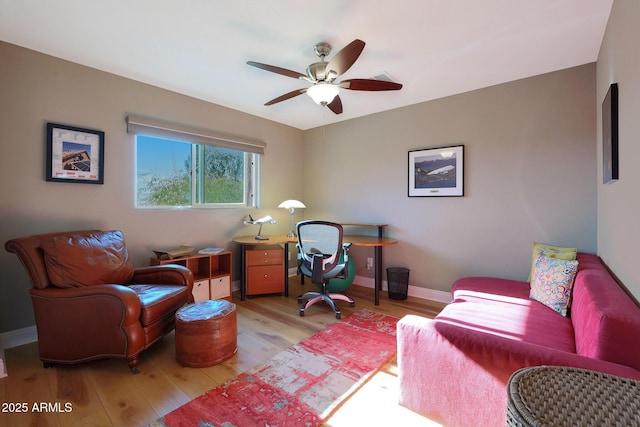 office area with ceiling fan and light hardwood / wood-style floors