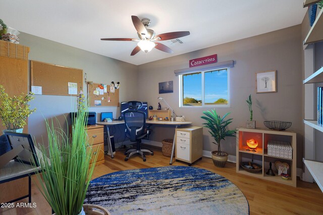 office area with ceiling fan and light hardwood / wood-style flooring