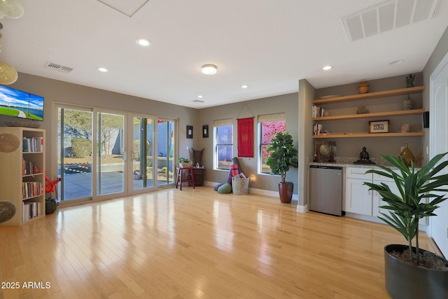 workout area featuring light hardwood / wood-style floors