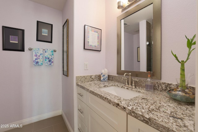 bathroom featuring tile patterned flooring and vanity