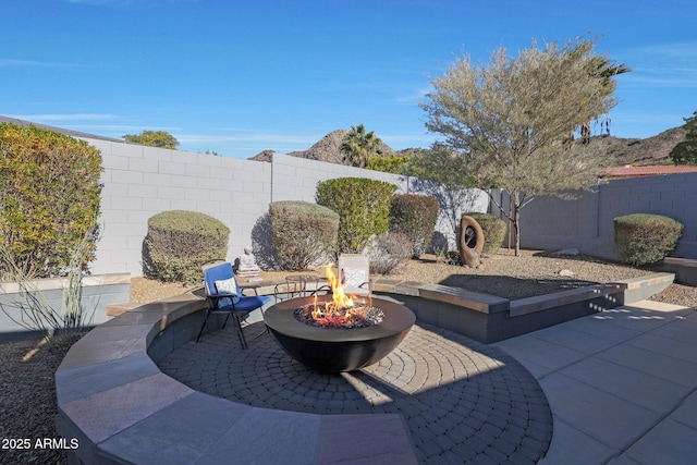 view of patio / terrace featuring an outdoor fire pit