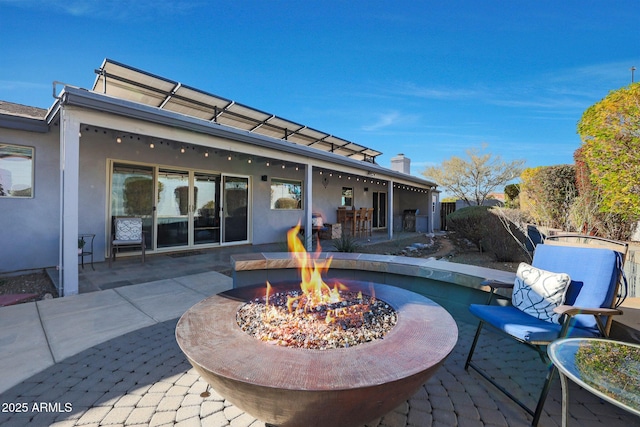 view of patio featuring a fire pit