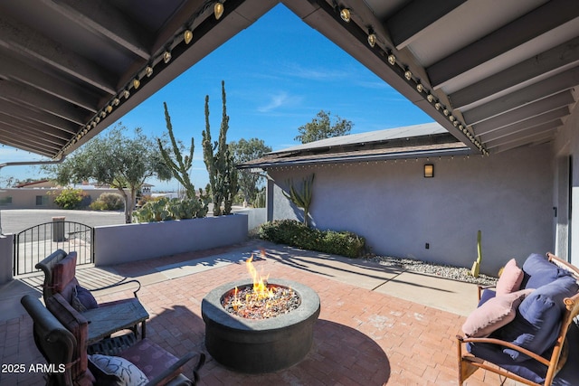 view of patio featuring an outdoor fire pit