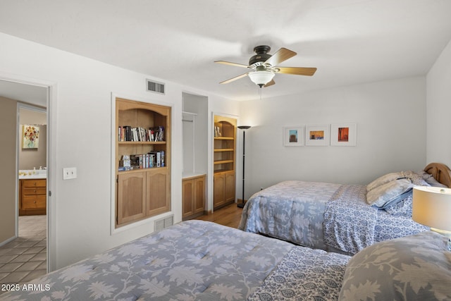 bedroom featuring ceiling fan and ensuite bath