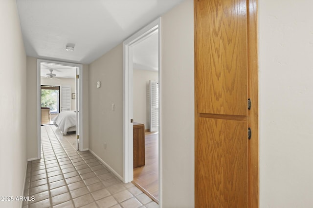 hallway featuring light tile patterned floors