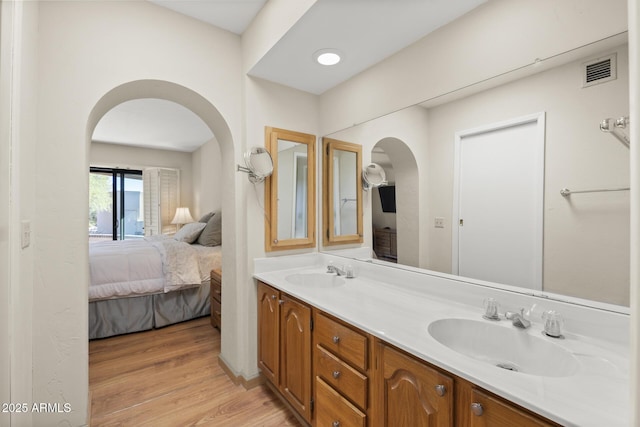 bathroom featuring vanity and hardwood / wood-style flooring