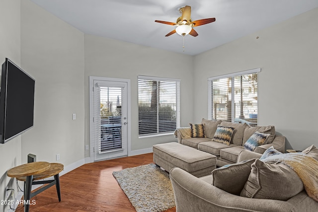 living room with hardwood / wood-style flooring and ceiling fan