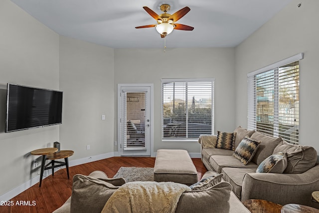 living room with a wealth of natural light, ceiling fan, and wood-type flooring