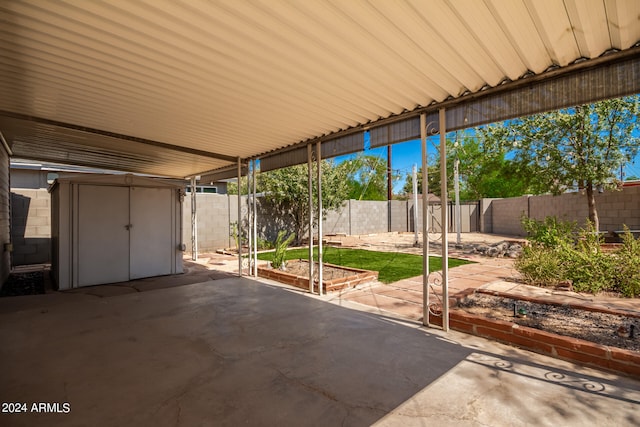 view of patio featuring a shed