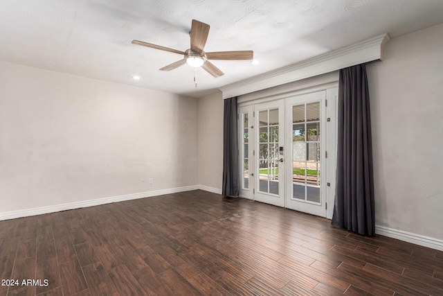 unfurnished room featuring dark hardwood / wood-style floors, ceiling fan, and french doors