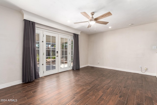 spare room with french doors, dark hardwood / wood-style flooring, and ceiling fan