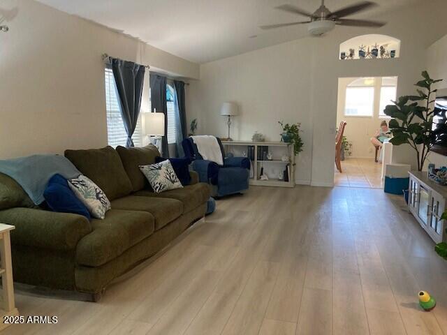 914 W Morelos St, Chandler, AZ 85225 - living room with a ceiling fan, light wood-style flooring, and vaulted ceiling