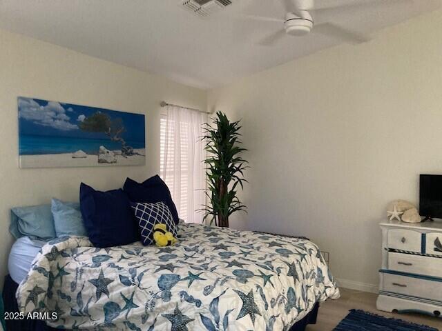 914 W Morelos St, Chandler, AZ 85225 - bedroom featuring a ceiling fan, wood finished floors, and baseboards