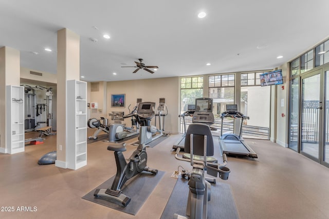 workout area with a wall of windows and ceiling fan