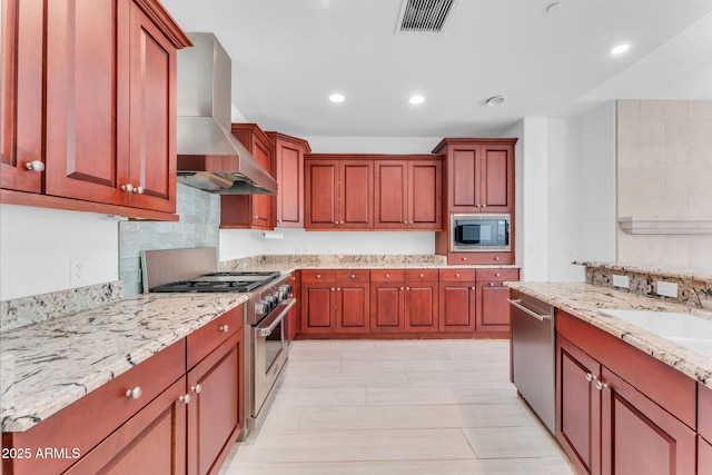 kitchen featuring ventilation hood, sink, decorative backsplash, light stone counters, and stainless steel appliances