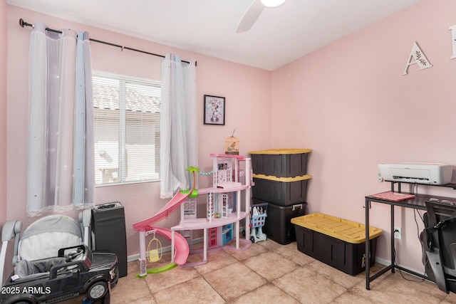 playroom featuring tile patterned flooring, baseboards, and a ceiling fan