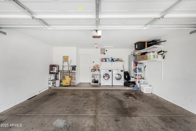 garage with a garage door opener, water heater, and washing machine and clothes dryer