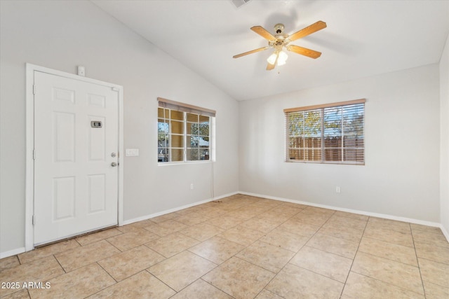 tiled empty room with ceiling fan and lofted ceiling