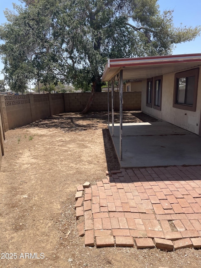 view of yard with a patio and a fenced backyard