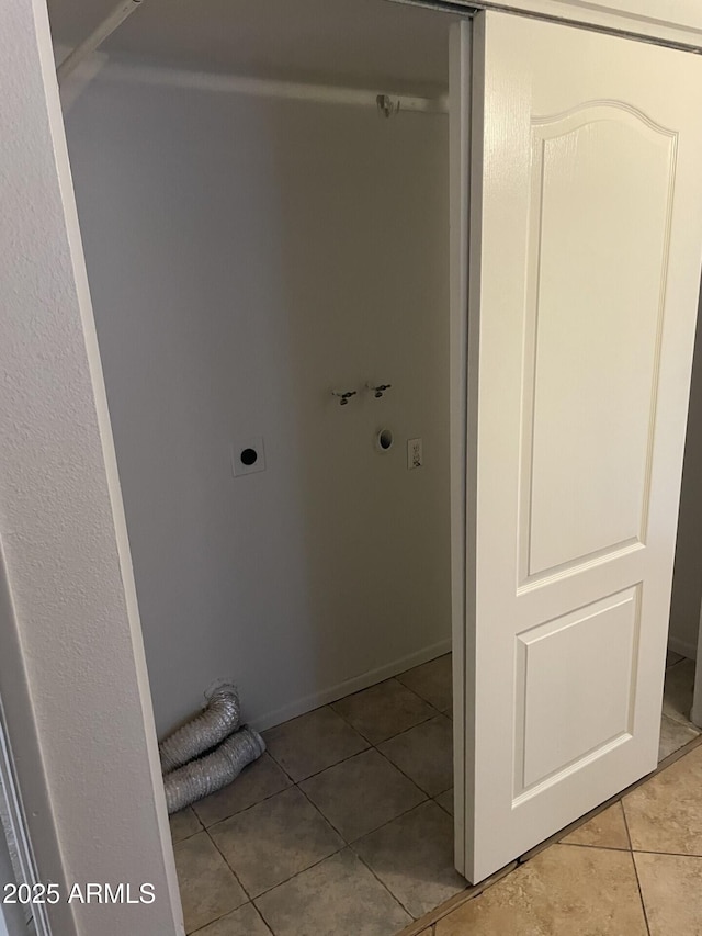 bathroom featuring baseboards and tile patterned floors