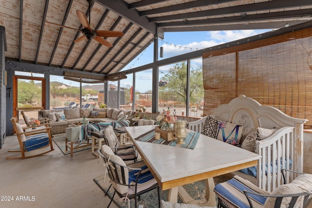 sunroom / solarium featuring lofted ceiling with beams, wood ceiling, and ceiling fan