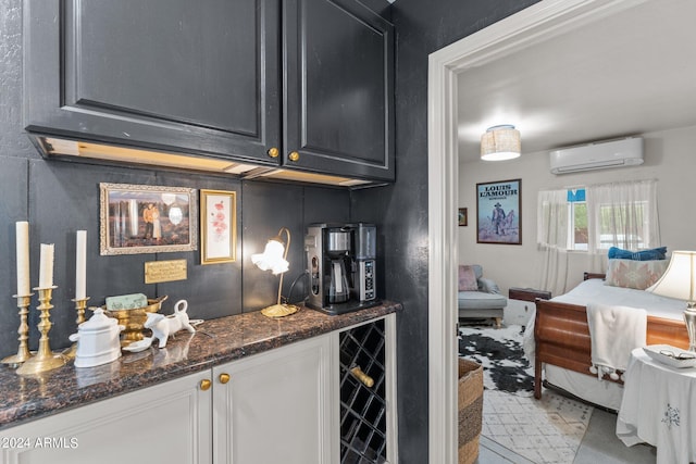 bar featuring wine cooler, dark stone countertops, and an AC wall unit