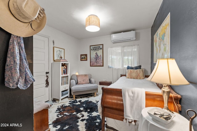 bedroom featuring an AC wall unit