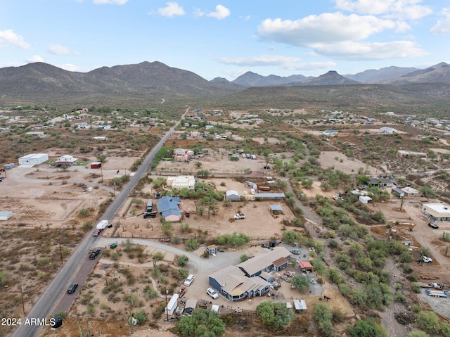 birds eye view of property with a mountain view