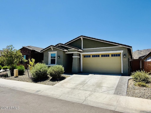 1657 W Monte Way, Phoenix, AZ 85041 - single story home with an attached garage, concrete driveway, and stucco siding
