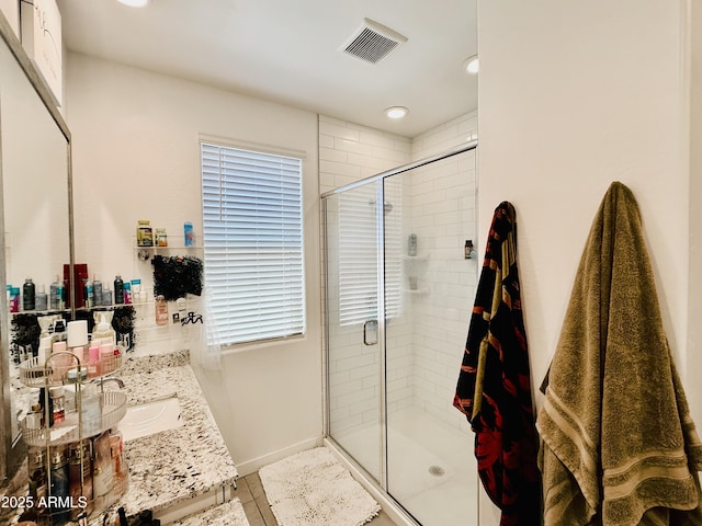 1657 W Monte Way, Phoenix, AZ 85041 - bathroom with a shower stall, recessed lighting, and double vanity