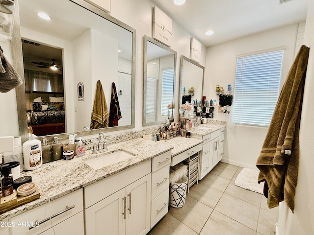 1657 W Monte Way, Phoenix, AZ 85041 - full bath with double vanity, tile patterned flooring, a ceiling fan, and recessed lighting